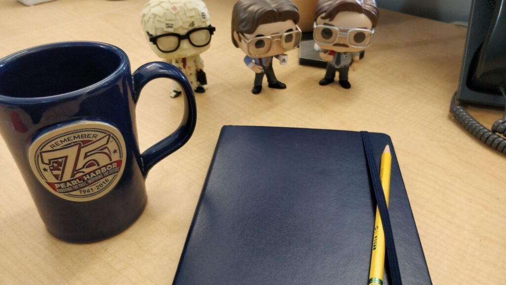 My 2020 Bullet Journal on my desk at work