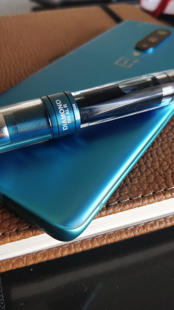 One Plus 8 Glacial Green and TWSBI 580 Prussian Blue