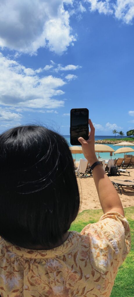 Zarah taking a photo on her iPhone