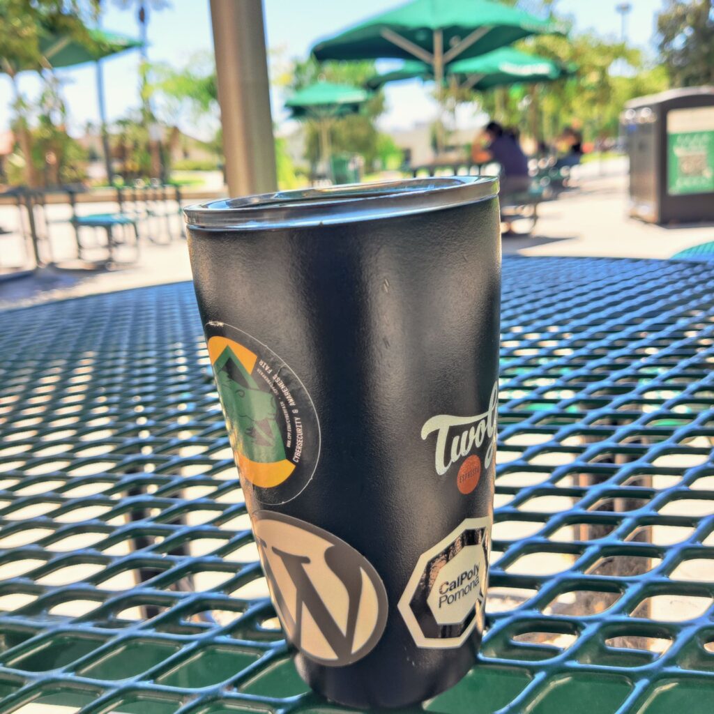 MIIR coffee tumbler covered with stickers