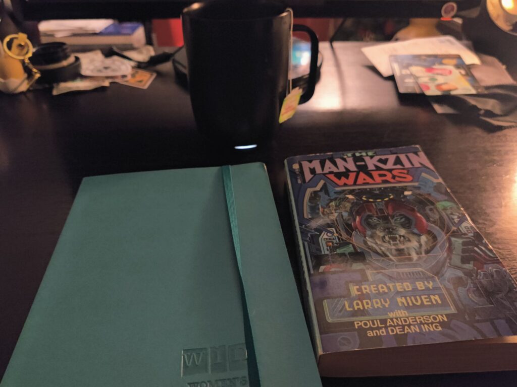 Reading journal and novel on a desk